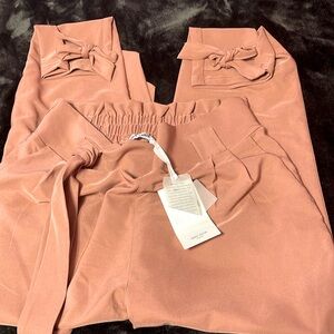 Grace Karin pant size Lg , more a Dusty sand in color with adorable bows